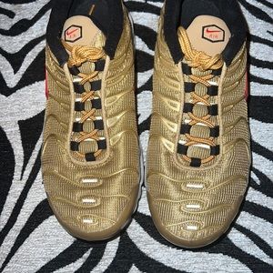 Gold Nike TN Air shoes